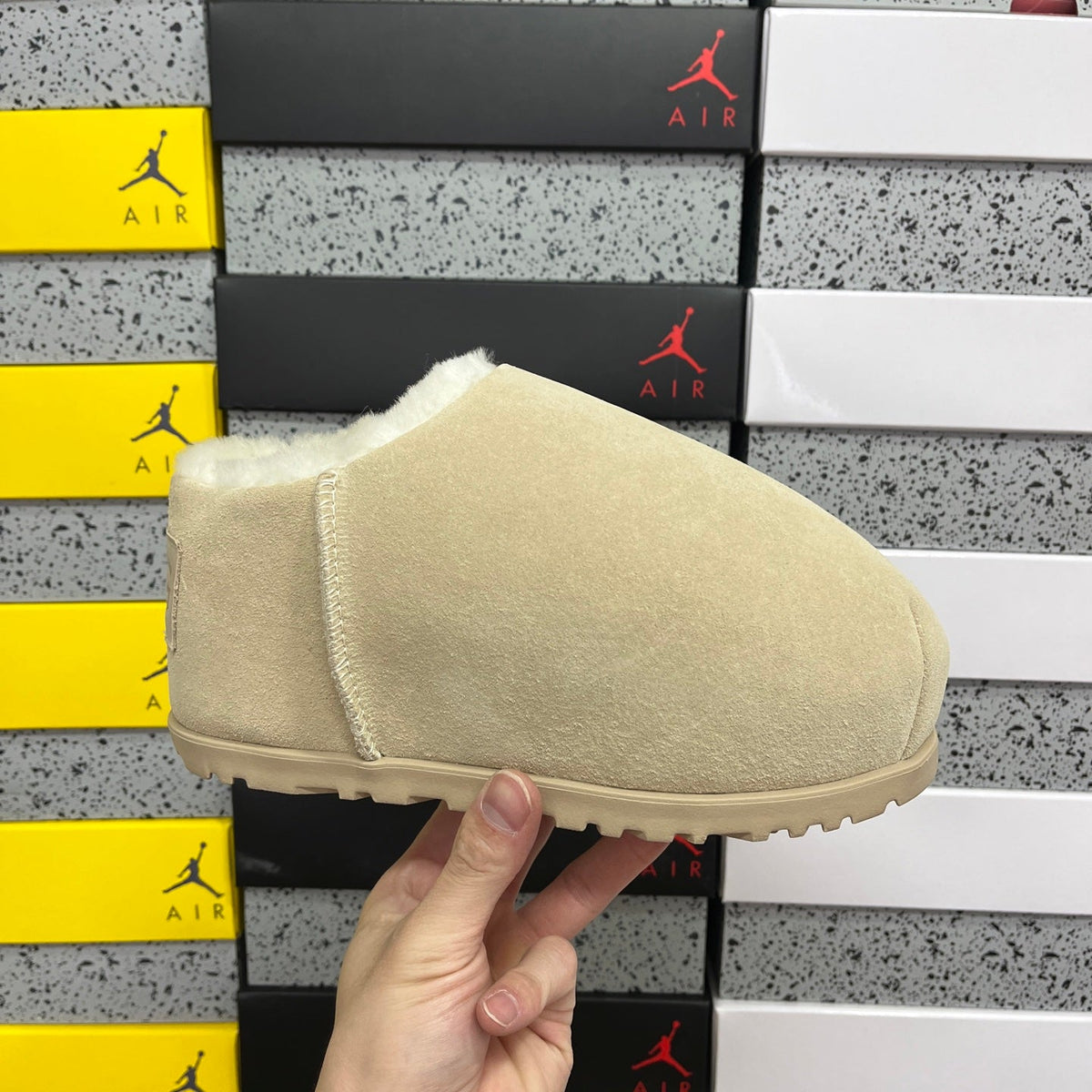 UGG Classic Ultra Mini Boot – Suede Ankle Boot with Shearling Lining, Embossed Logo Patch & Sand Lug Sole in Sand