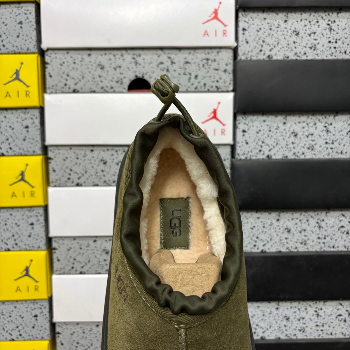 UGG Neumeel Deco Slip-On – Suede Moccasin Sneaker with Black Lug Sole & Tonal Drawstring in Olive