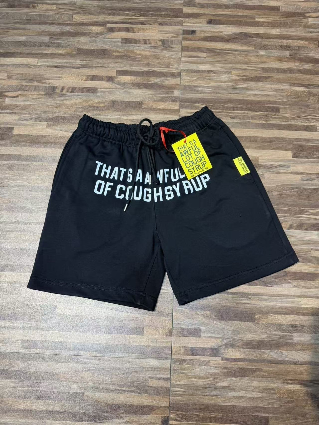 THAT'S A AWFUL LOT OF COUGH SYRUP Black Graphic Shorts