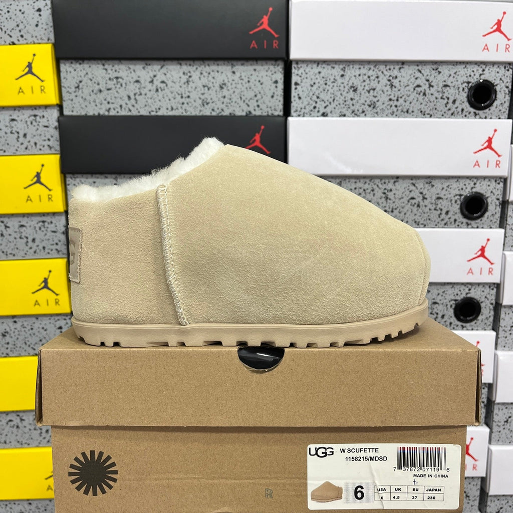 UGG Classic Ultra Mini Boot – Suede Ankle Boot with Shearling Lining, Embossed Logo Patch & Sand Lug Sole in Sand