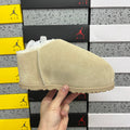 UGG Classic Ultra Mini Boot – Suede Ankle Boot with Shearling Lining, Embossed Logo Patch & Sand Lug Sole in Sand